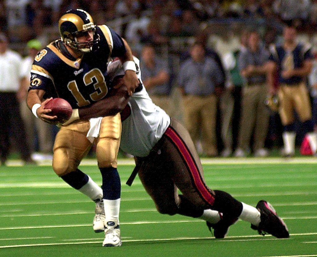 St. Louis Rams quarterback Kurt Warner (L) is sack