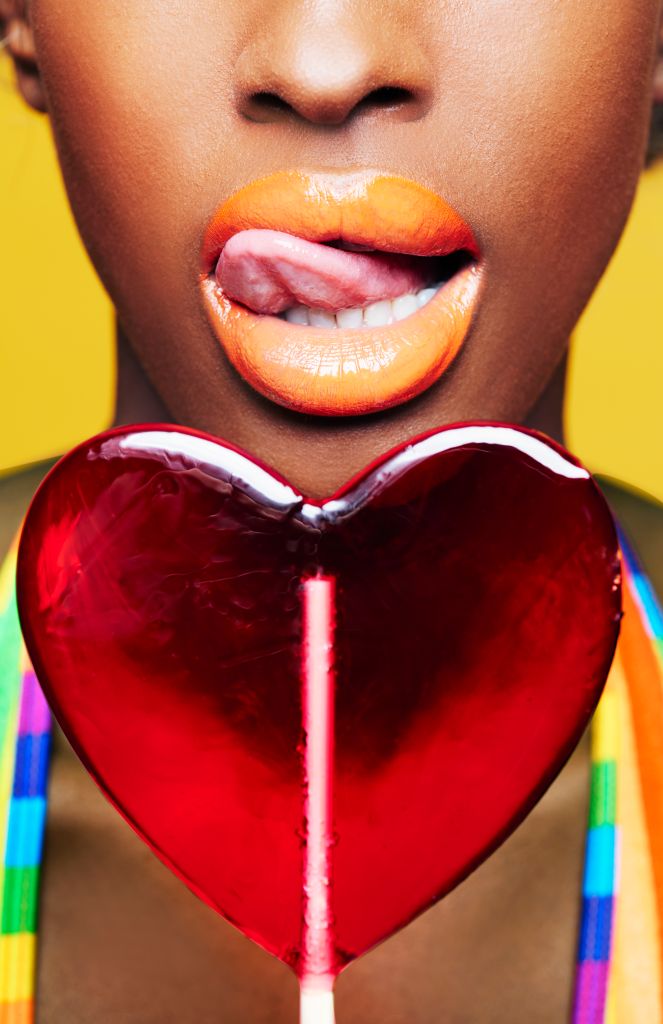 woman with heart shaped lollipop