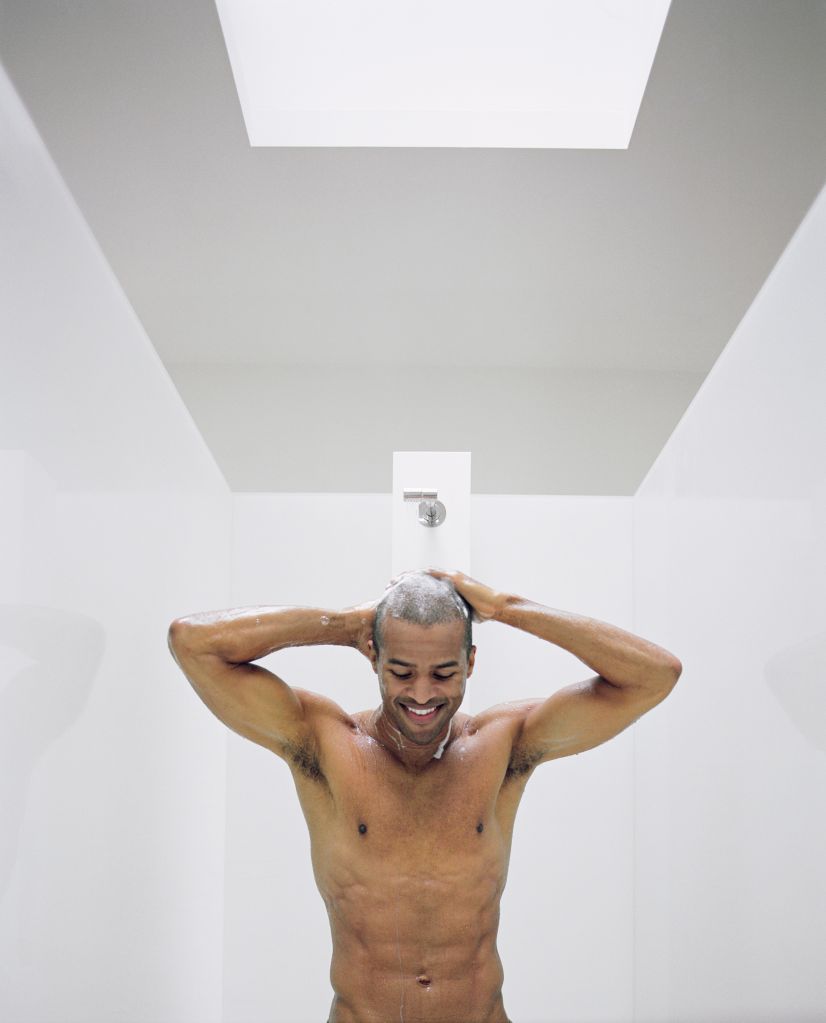 Man washing hair in shower