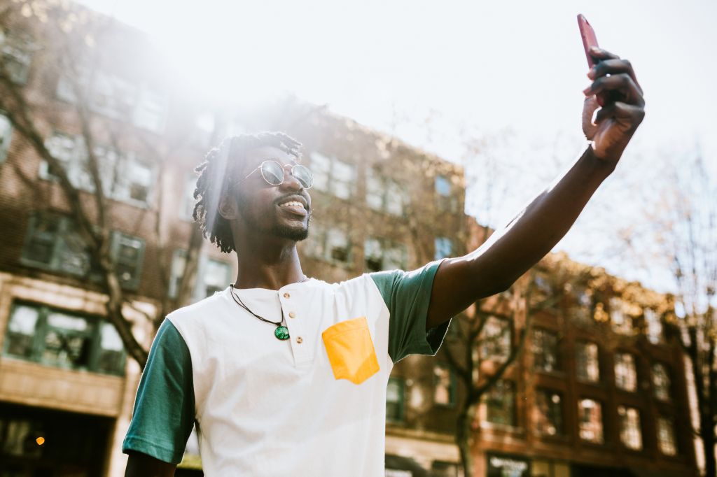 A Young Man Takes Selfie in Downtown Seattle