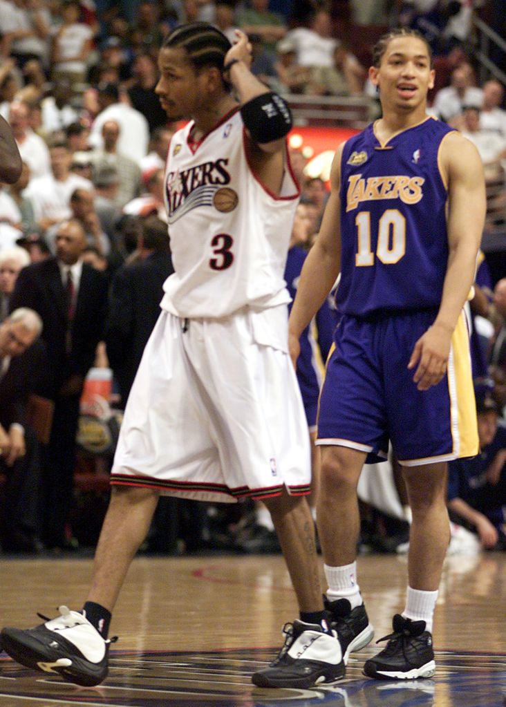 031213.SP.0610.lakers33.GFLaker Tyronn Lue cracks a smile as Sixer Allen Iverson can only scratch h