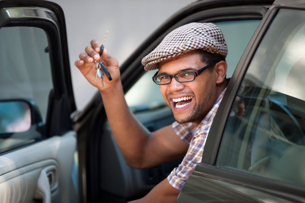 Smiling Man Holding Car Keys