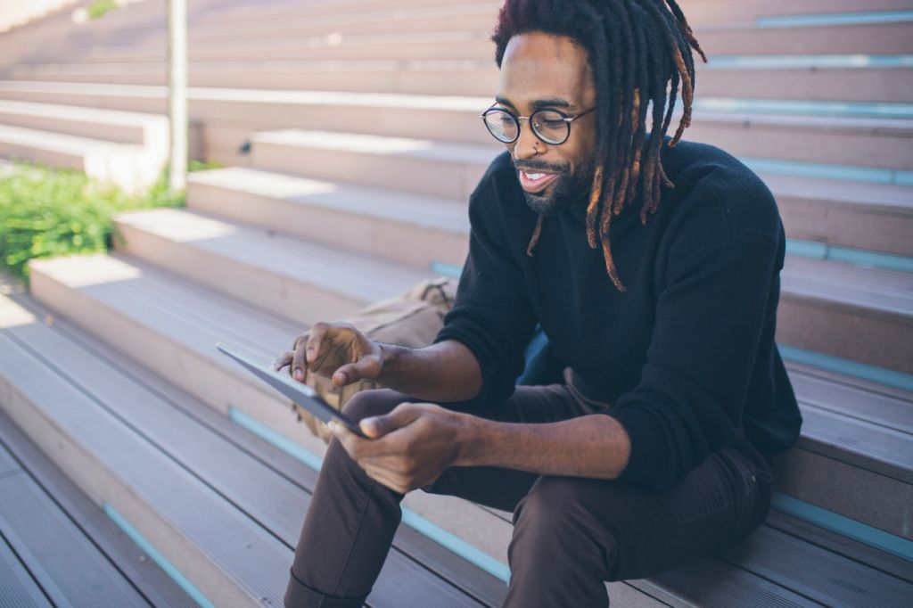 African american businessman using tablet outdoors