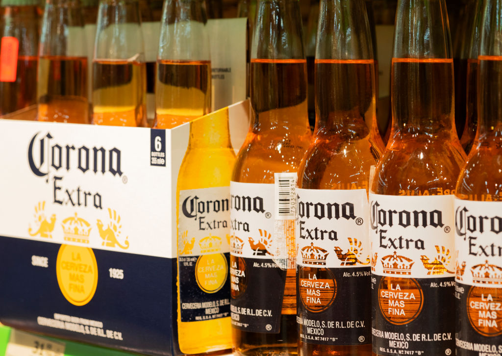 Bottles of Corona extra beer are seen on a shelf...