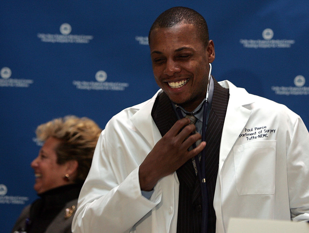 (020107 Boston, MA) Tufts-New England Medical Center dedicates their minimally invasive surgery center to Celtic Paul Pierce at a ceremony at NEMC on Thursday, February 01, 2007. Celtics Paul Pierce tries on a lab coat and stethoscope as NEMC pres