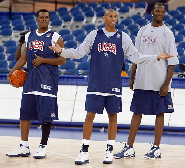 Reggie Miller (C) of the USA Basketball team stand