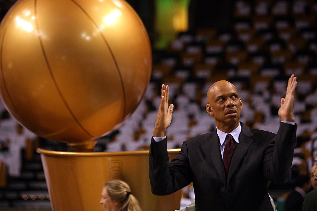 (060508 Boston, MA) Kareem Abdul-Jabbar gestures in front of the trophy before Game 1 of the NBA finals basketball series between the Celtics and the Los Angeles Lakers at the TD Banknorth GardenThursday, June 5, 2008. Staff Photo by Matt Stone