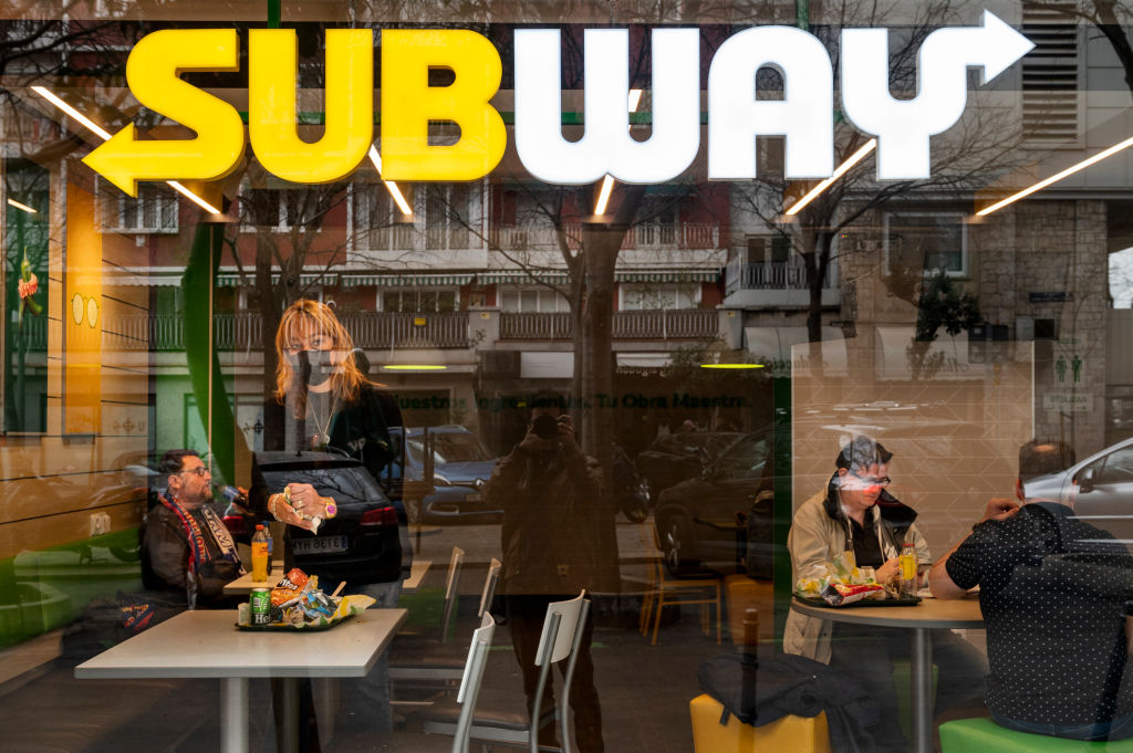 Customers are seen at the American sandwich fast food...