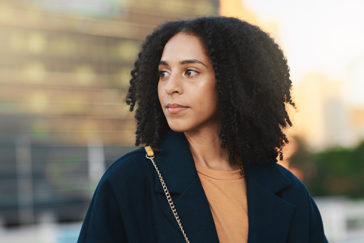 Face, thinking and city with a business black woman walking while on her morning commute into work. Idea, commuting and street with a female employee traveling in an urban town for opportunity