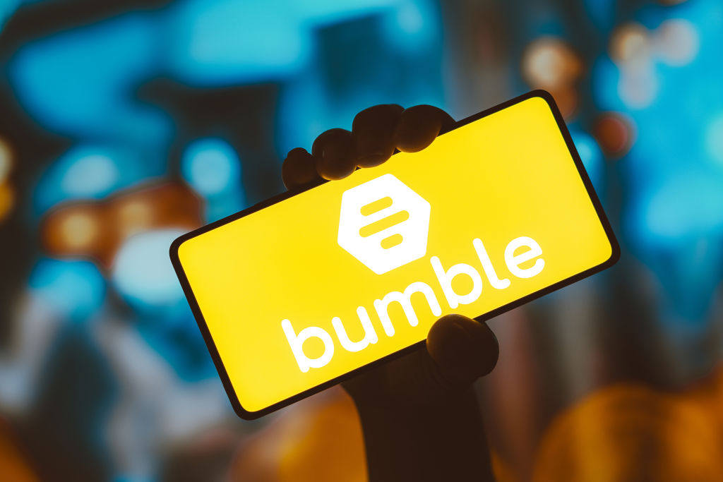 In this photo illustration, the Bumble logo is displayed on...