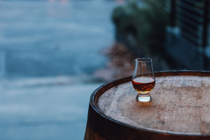 Glencairn glass on whiskey barrel