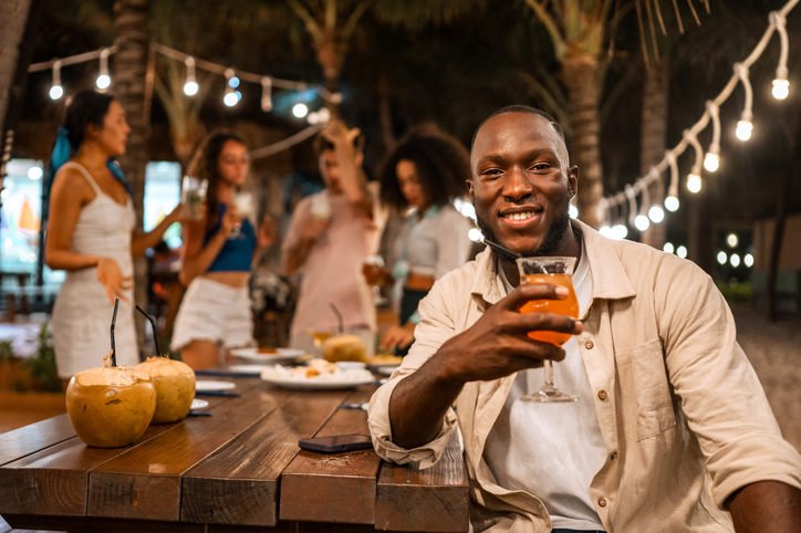Joyful Black Man at Outdoor Dinner Celebration
