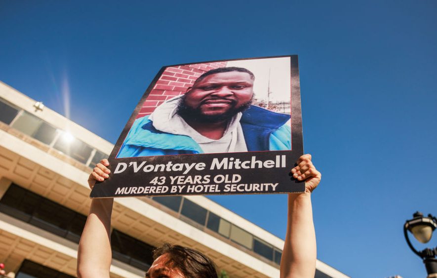 Protesters march and protest against the deaths of two Black...
