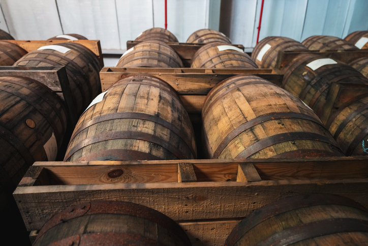 Upward view of wooden barrels of aging rum