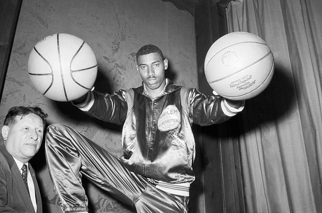 Wilt Chamberlain Holding Two Basketballs