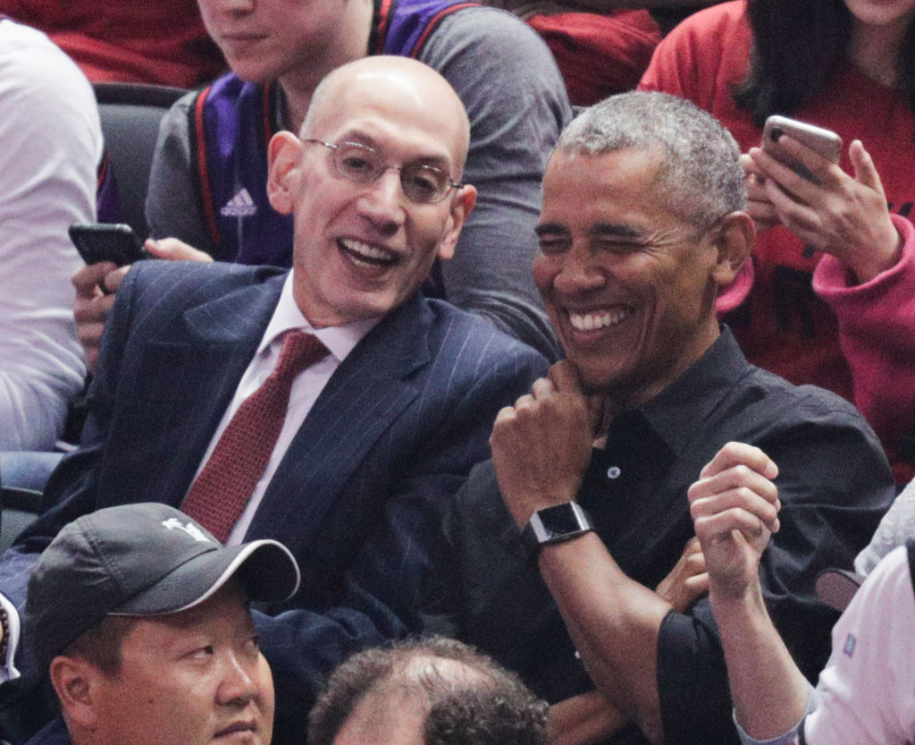 NBA Commissioner Adam Silver and President Barack Obama talk during the first quarter during game 2 of the NBA Finals between the Golden State Warriors and the Toronto Raptors at Scotiabank Arena on Sunday, June 2, 2019 in Toronto, Ontario, Canada.