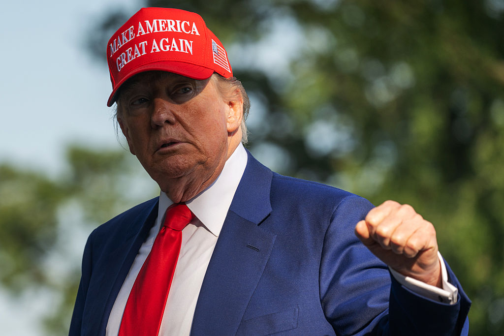 WASHINGTON, DC - JUNE 21: President Donald Trump raises his fis