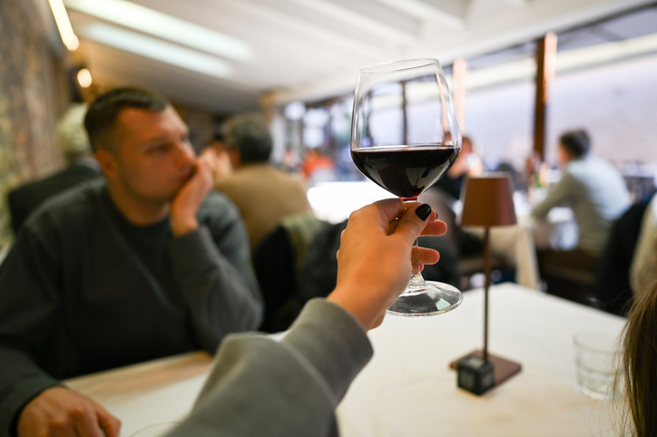 Drinking wine at restaurant.